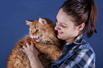 woman and Maine Coon