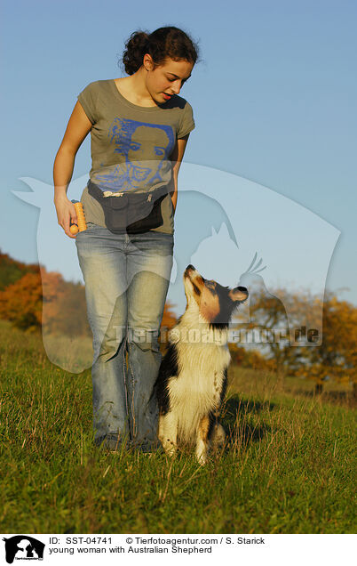 young woman with Australian Shepherd / SST-04741