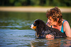 woman and young Bernese Mountain Dog
