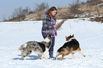 woman with 2 dogs in the snow