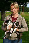 woman with Boston Terrier Puppies