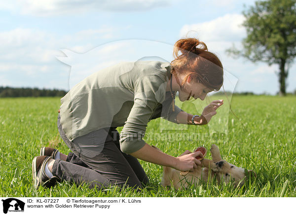 woman with Golden Retriever Puppy / KL-07227