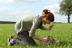 woman with Golden Retriever Puppy