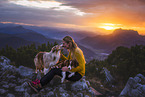 young woman with 2 Miniature Australian Shepherds