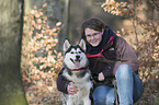 woman and Siberian Husky