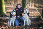 woman and 2 Siberian Husky