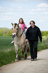 girl rides Fjord horse