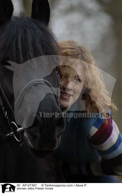 woman rides Frisian horse / AP-07387