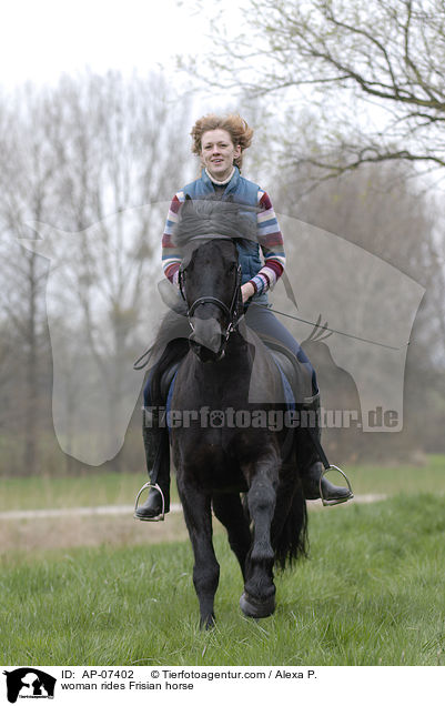woman rides Frisian horse / AP-07402
