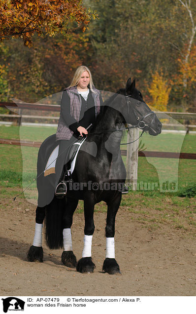 woman rides Frisian horse / AP-07479