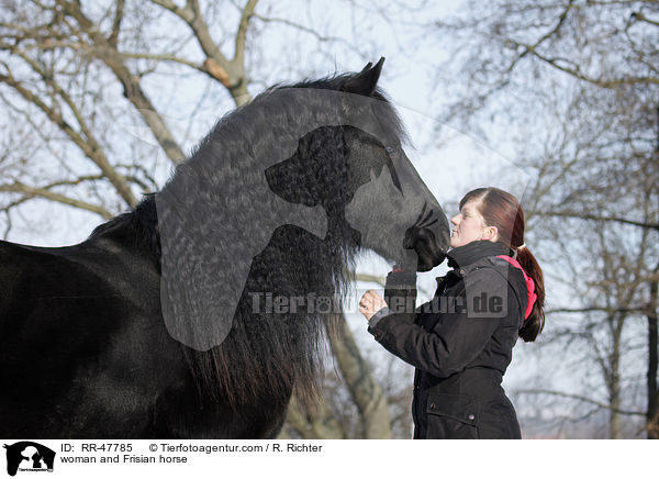 woman and Frisian horse / RR-47785