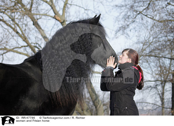 woman and Frisian horse / RR-47786
