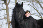 woman with Frisian horse