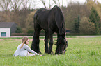 woman and Friesian horse
