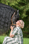 woman and Friesian Horse