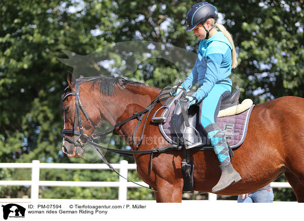 woman rides German Riding Pony / PM-07594