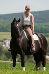 woman rides Hanoverian