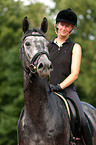 woman rides Hanoverian horse