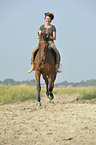 woman rides Hanoverian