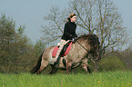 woman rides Icelandic horse