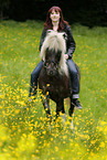 woman rides Icelandic horse