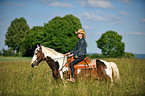 woman rides horse