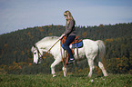 woman rides pony