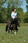 woman rides Shetland Pony