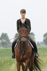 woman rides Trakehner