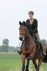 woman rides Trakehner