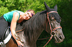 woman rides warmblood