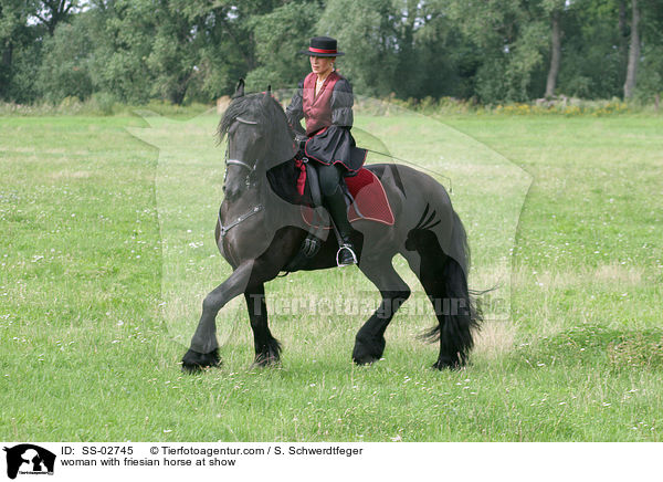 woman with friesian horse at show / SS-02745