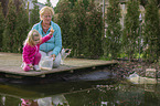 people at a Goldfish pond